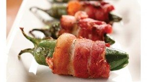 Anything wrapped in sweet, smoky bacon is a sure crowd pleaser especially these kicky peppers filled with warm, creamed cheese. Try another fun variation by stuffing a large, dried date with a smoked almond, wrapping with a slice of bacon then grilling until the bacon is crispy. Outstanding!