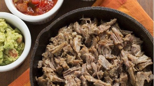 Carnitas means “little meats.” Simple in technique yet complex in flavor, this is a recipe even a beginner can try with confidence. It uses the pork shoulder, which after slow cooking pulls into a thousand succulent little shreds. Delicious!