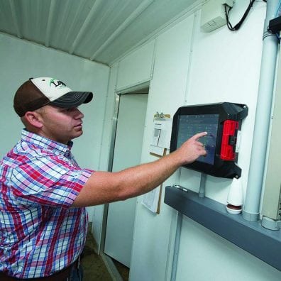 Evan Jackson can adjust the hog barn controls from the office or with his smartphone.