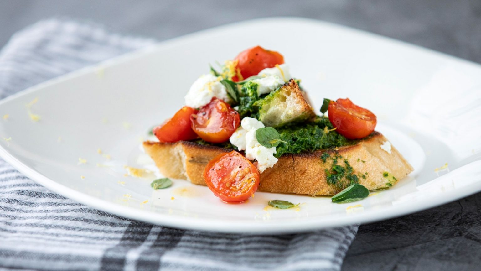 Our Ohio Recipe Tomato Bruschetta with Arugula Pesto and Goat Cheese