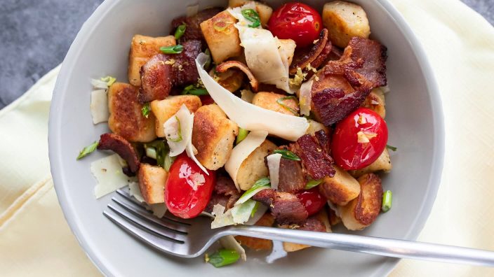Gnocchi with bacon, herb and blistered cherry tomatoes